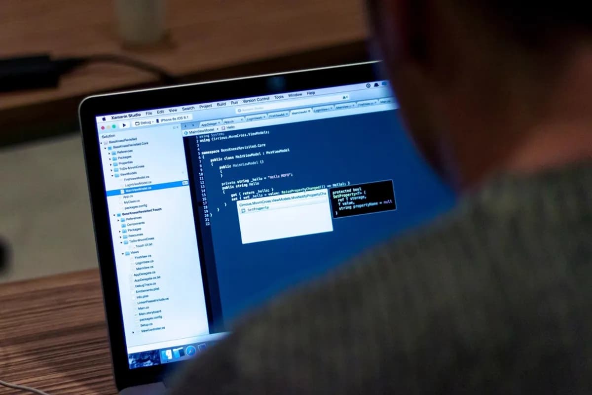 QA engineer testing and debugging a mobile app in a development environment