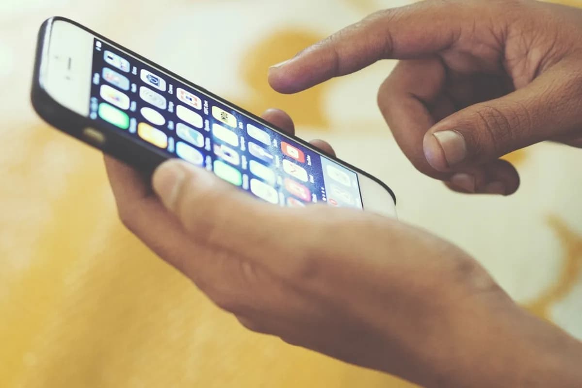 Customer using an on-demand delivery app on a smartphone