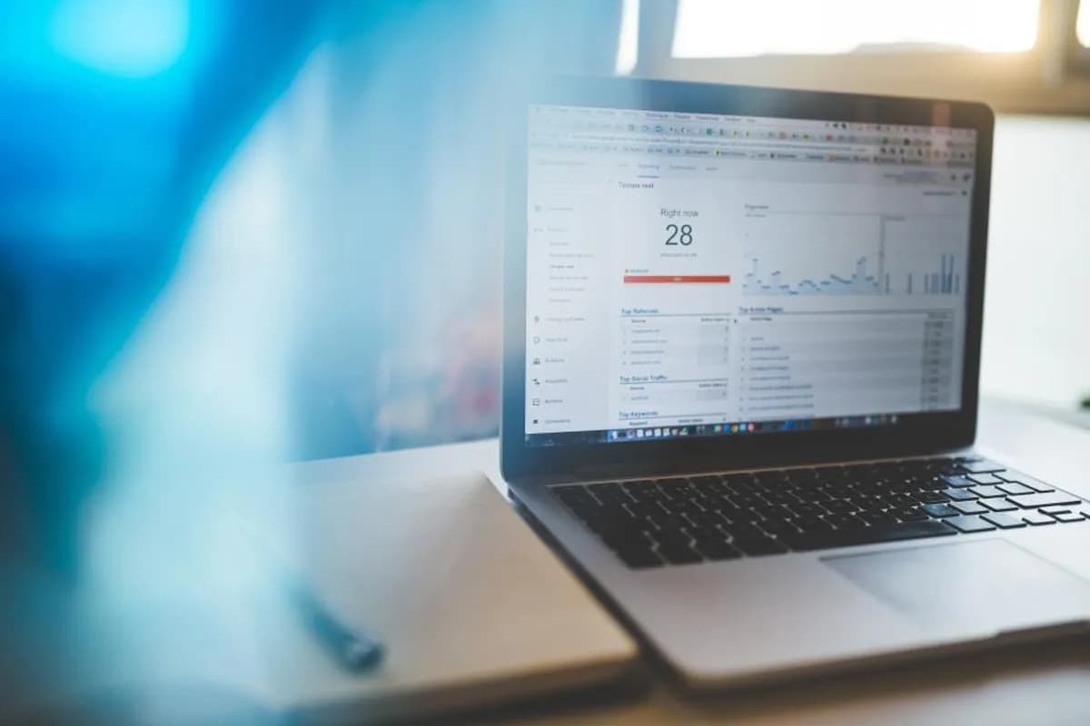 Analytics dashboard showing automated business process metrics on a laptop